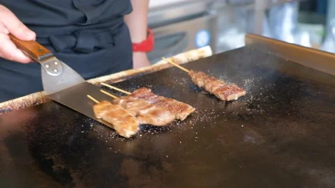 Japanese street food vendor cooking wagy... | Stock Video | Pond5