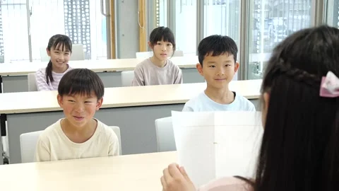 Japanese Student Giving Presentation to Classmates in Classroom Stock-Footage 344095280