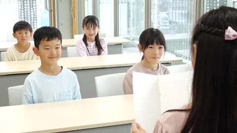 Japanese Student Giving Presentation to Classmates in Classroom Stock-Footage 344095616