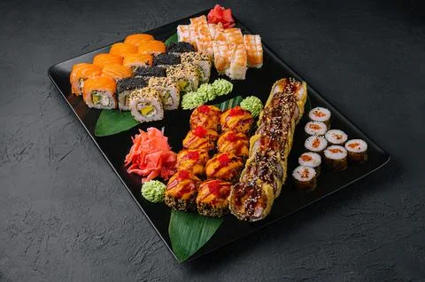 Assortment of Sushi Roll Set on a Black Tray. Japanese Food Stock