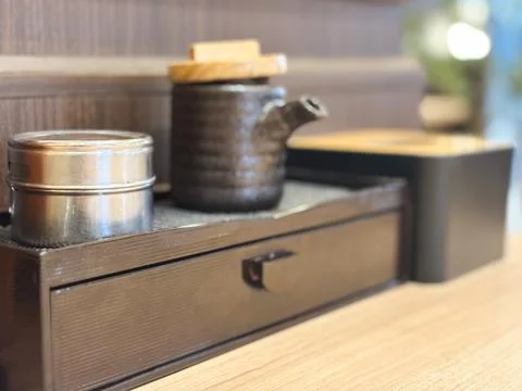 Japanese Table Condiment Set Ceramic Soy Sauce Bottle Spice Tin in a Restaurant Stock Photos