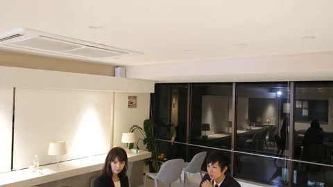 Japanese team working on project at office gimbal shot Vídeo Stock 80977345