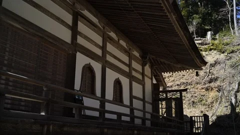Japanese temple architecture in forest setting, traditional wooden shrine i.. Vídeos de archivo 331491640