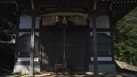 Japanese temple architecture in forest setting, traditional wooden shrine i.. 動画素材 331491671