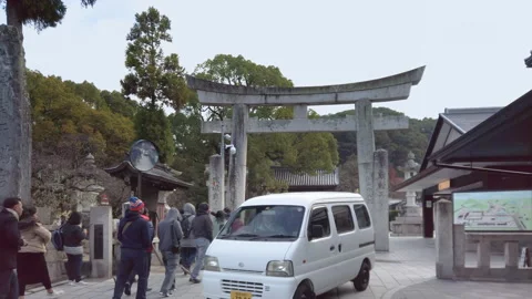 Japanese tiny kei car passing in the Japanese Dazaifu shrine. Stock Footage 247655023