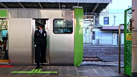 Japanese Train Driver or Conductor press door closing melody button Stock Footage 189496881