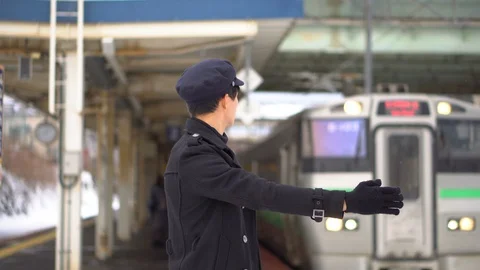 Japanese Train Station Master Staff Pointing For Train Signaling Stock Footage 101002185