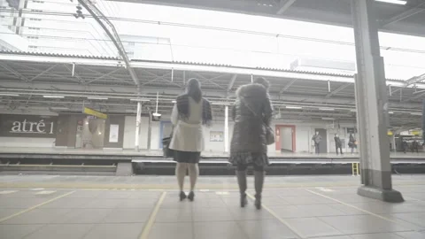JAPANESE TRAIN STATION -  PLATFORM SCENE 1 - UNGRADED Stock Footage 304097044
