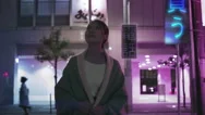 Japanese Woman In Future Augmented Reality Tokyo City Looks At Her Phone With Ho Stock Footage