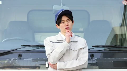 Japanese Worker Thinking in Front of Commercial Truck Stock Footage 344211843