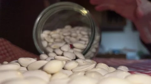 Jar of beans spilled on the table Stock Footage 221588178