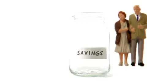 A jar being filled with coins Stock Footage 11285531