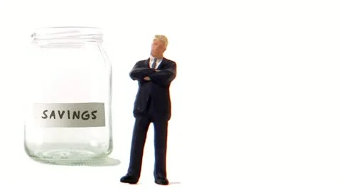 A jar being filled with coins Stock Footage 11285552