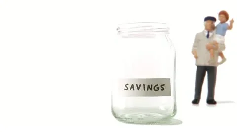 A jar being filled with coins Stock Footage 11285558