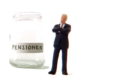 A jar being filled with coins. Stock Footage 51842944