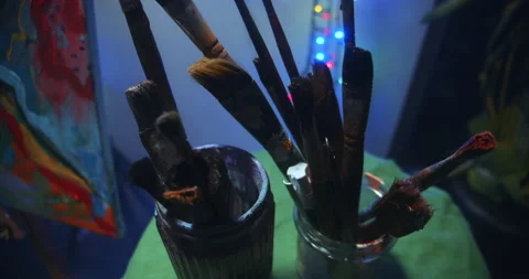 Jar with brushes in art studio Video stock 148200423