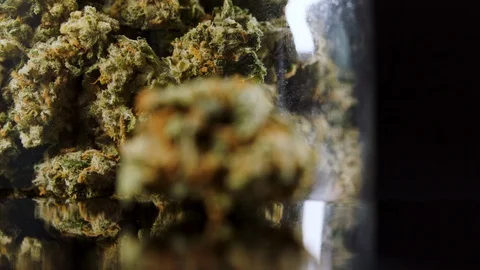 Jar of cannabis pull focus cannabis bud close-up 스톡 동영상 94339007