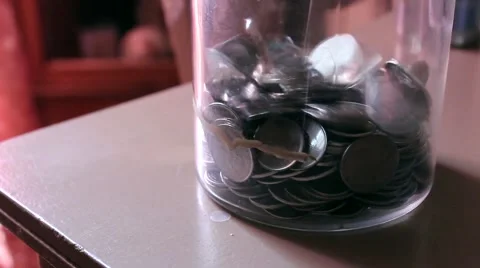Jar Of Change Filling Up Stock Footage 64973143