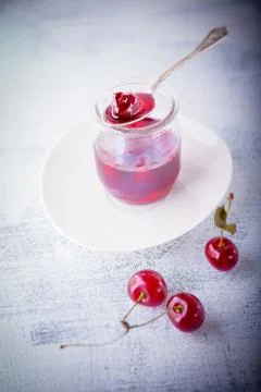Jar of Cherry jam Stock Photos