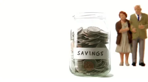 A jar with coins that decreases 库存影片 11285544