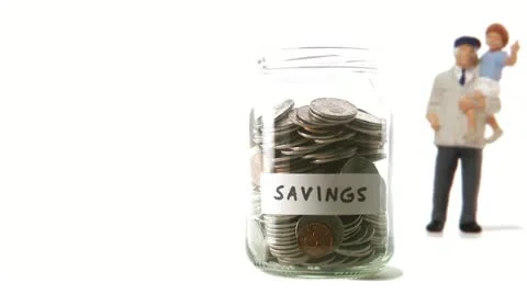 A jar with coins that decreases 库存影片 11285546