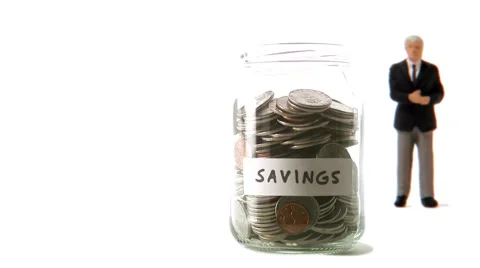 A jar with coins that decreases. Video stock 51842999