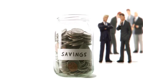 A jar with coins that decreases. Video stock 51843012