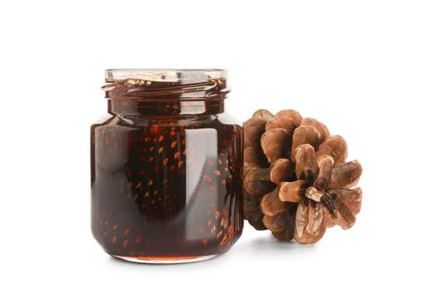 Jar of delicious pine cone jam on white background Stock Photos