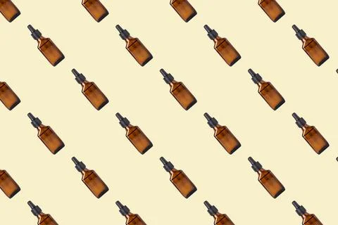 Jar with drip dispenser seamless pattern on gentle background. 库存照片