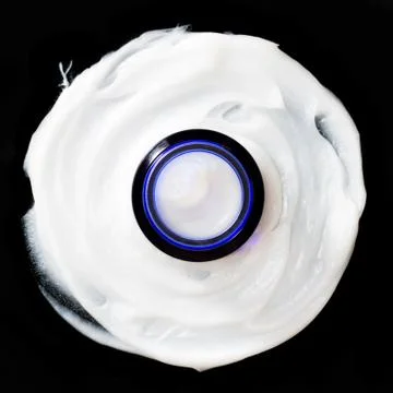 Jar of face cream on a smeared surface Stock Photos