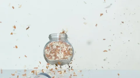 Jar with flakes falling after explosion, Ultra Slow Motion Stock-Footage 86578728