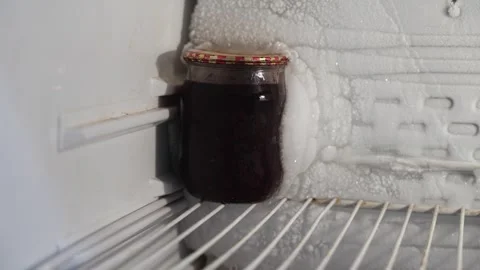 Jar Frozen to Freezer Wall Stock Footage 339919717