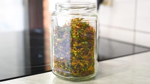 A jar full of dried St. John's wort. Tea in a jar. Stock Footage 314141256