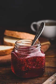 Jar of homemade raspberry jam Jar of homemade raspberry jam. Toasts for br... Stock Photos