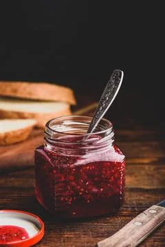 Jar of homemade raspberry jam Stock Photos