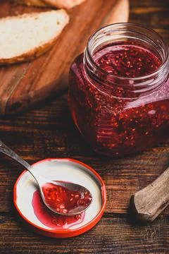 Jar of homemade raspberry jam Stock Photos