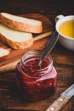 Jar of homemade raspberry jam Stock Photos