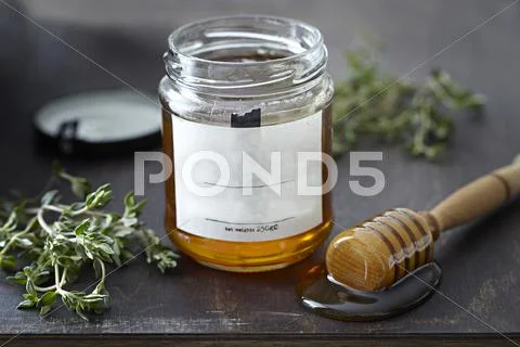Jar Of Honey With Herbs