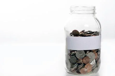 Jar of loose change Stock Photos