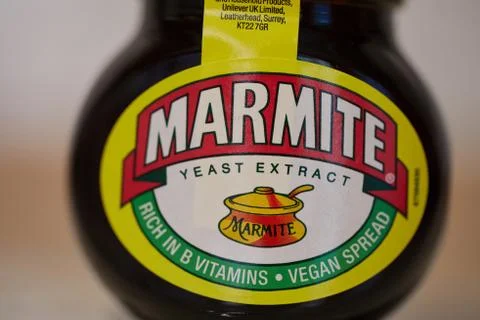 Jar of Marmite on a table Stock Photos