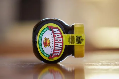 Jar of Marmite on a table Stock Photos