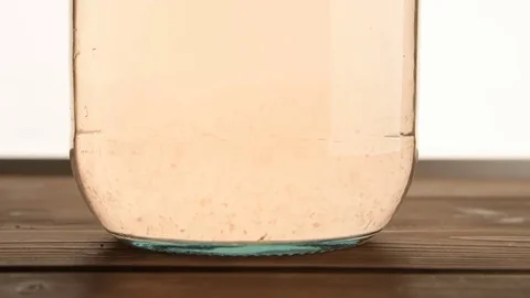 A jar of peach compote on a white background Stock Footage 84602203