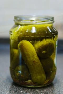 A jar of pickled cucumbers. Stock Photos