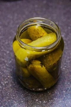 A jar of pickled cucumbers. Stock Photos