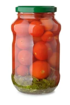Jar of pickled tomatoes Stock Photos