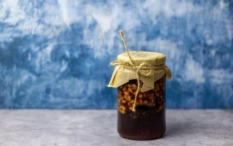 A jar of pine cone jam with pine nuts. Stock Photos
