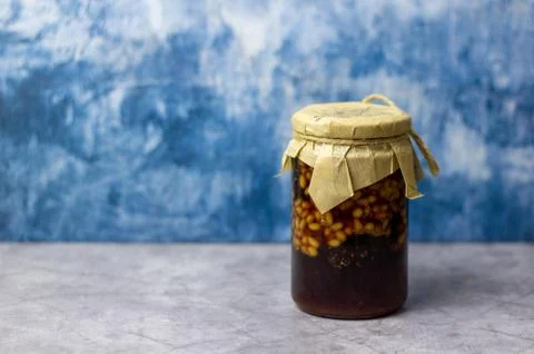 A jar of pine cone jam with pine nuts. Stock Photos