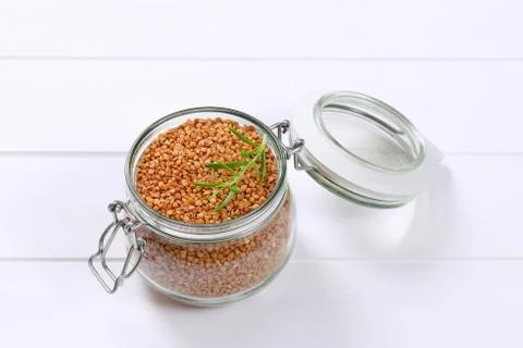 Jar of raw buckwheat Stock Photos