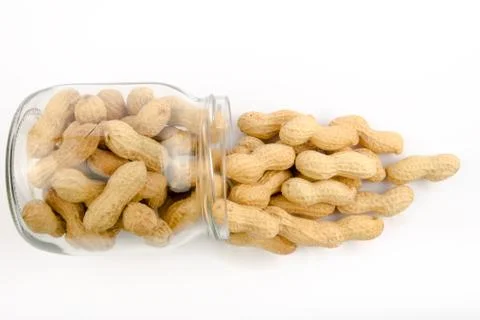 A jar of roasted peanuts in shell Stock Photos