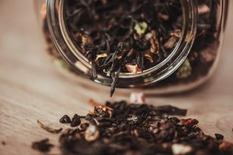 Jar with scattering of tea Stock Photos
